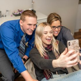 Aberdeen dentist with his patients after Dental Implants